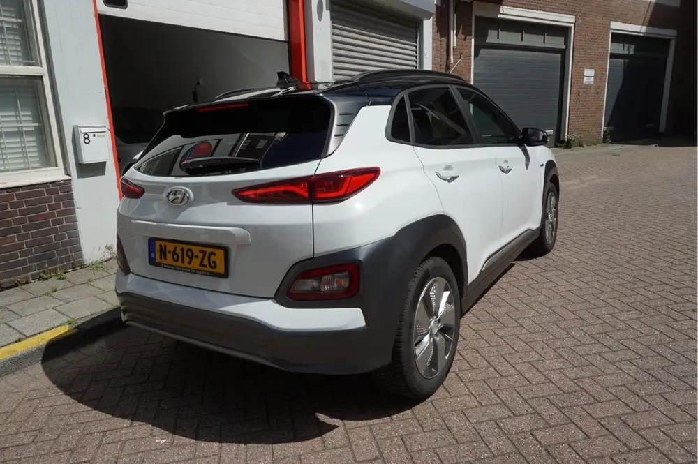 Hyundai Kona EV Premium 64 kWh | SOH 99.2% | Trekhaak | Leer uit 2019, foto 5
