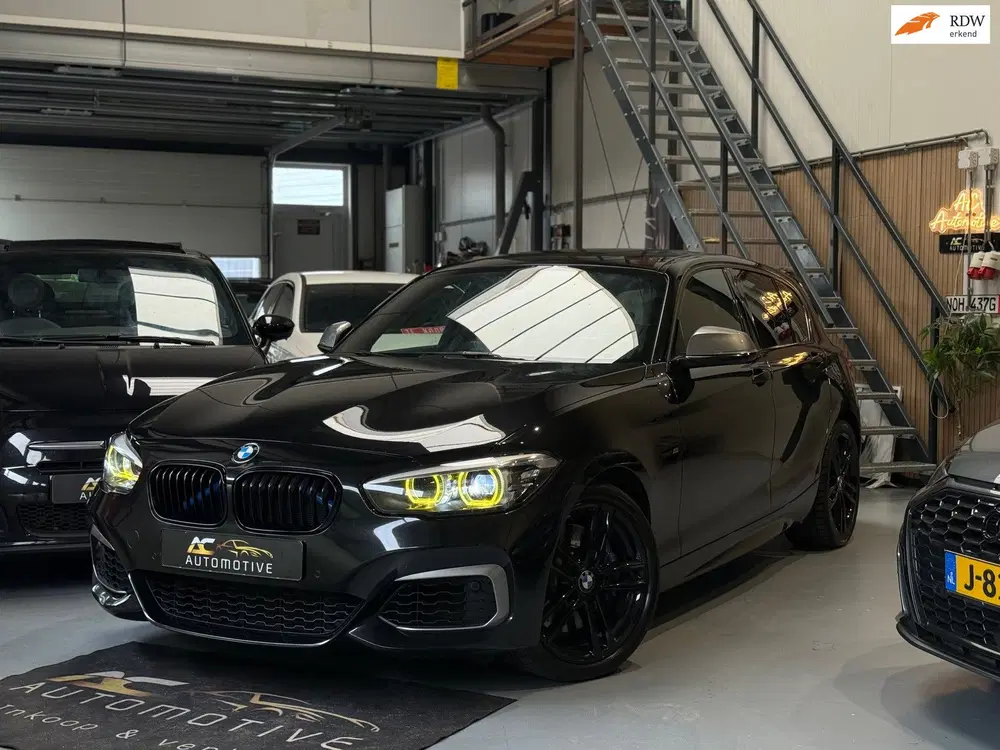 BMW 1-serie M140i xDrive High Executive Harman uit 2019