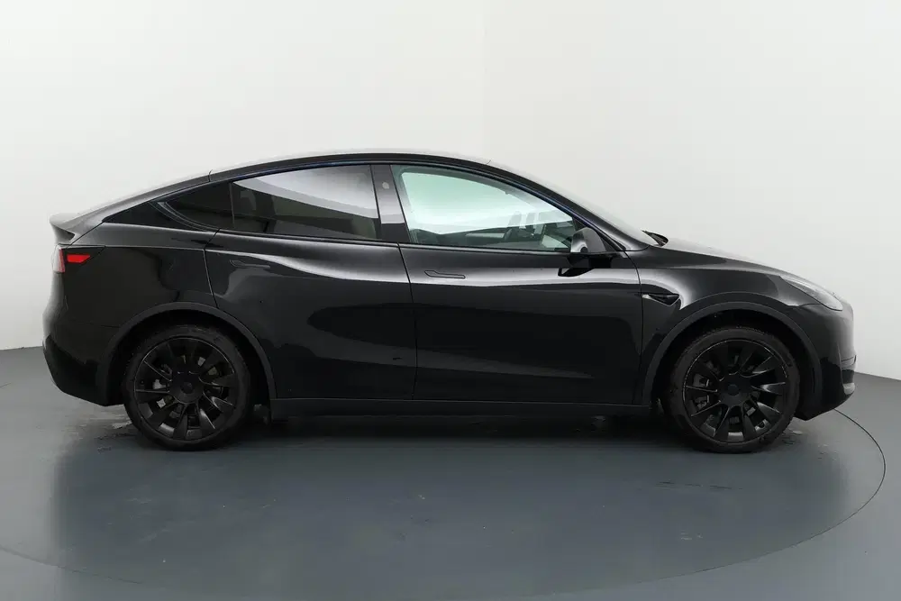 Tesla Model Y RWD 58 kWh Stijlvol en stil onderweg met v uit 2024, foto 12
